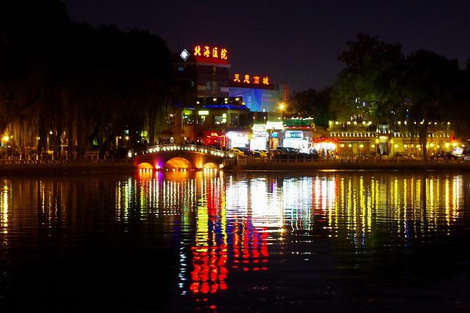 Beijing Imperial Dining Experience at Bai Jia Da Yuan Restaurant with Houhai Lake Bar Tour - From hotel pickup to imperial gates: how the evening flows