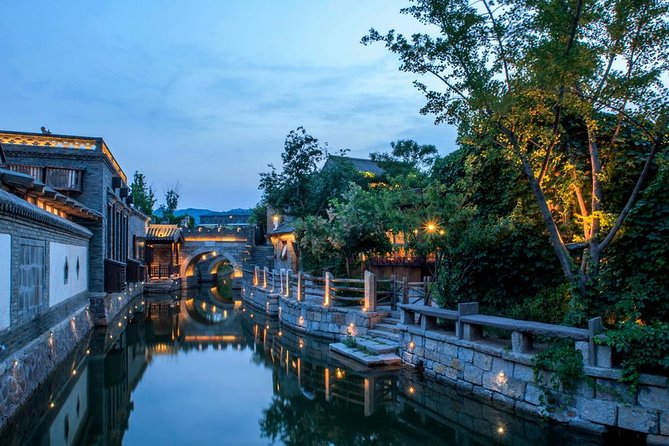 Private Evening Tour to Simatai Great Wall and Gubei Water Town - Gubei Water Town at night: lights, fountains, and relaxed exploring