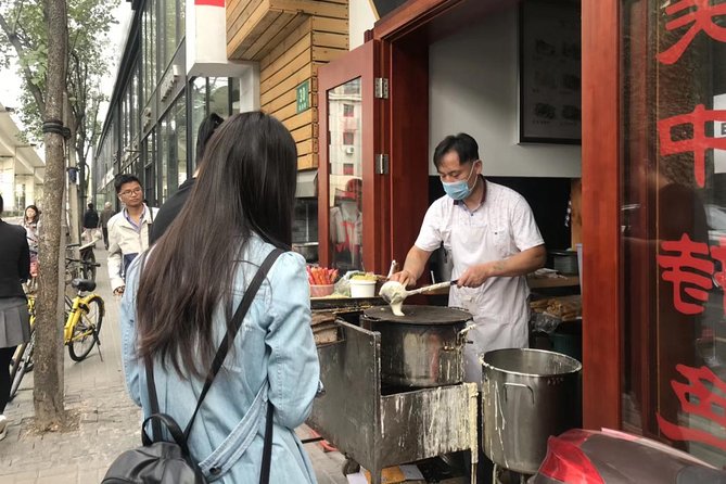 Private Tour: Beijing Hutong Night Walking and snacks Taste - St Joseph’s Church to snack street: a contrast you can feel